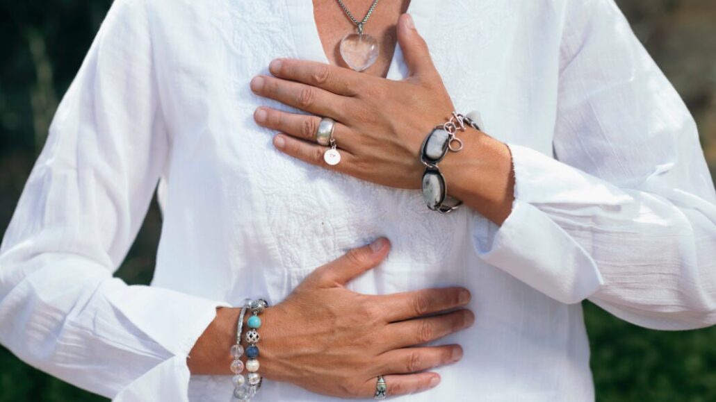 woman hand on chest and stomach