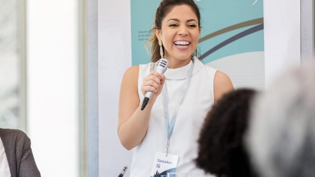 woman public speaking with microphone