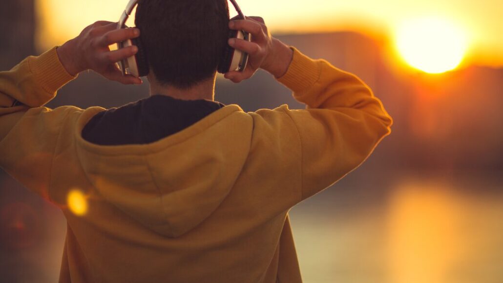 man listening to music in headphones for mental health