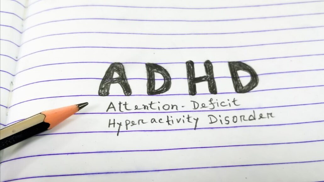 ADHD written on paper in pencil